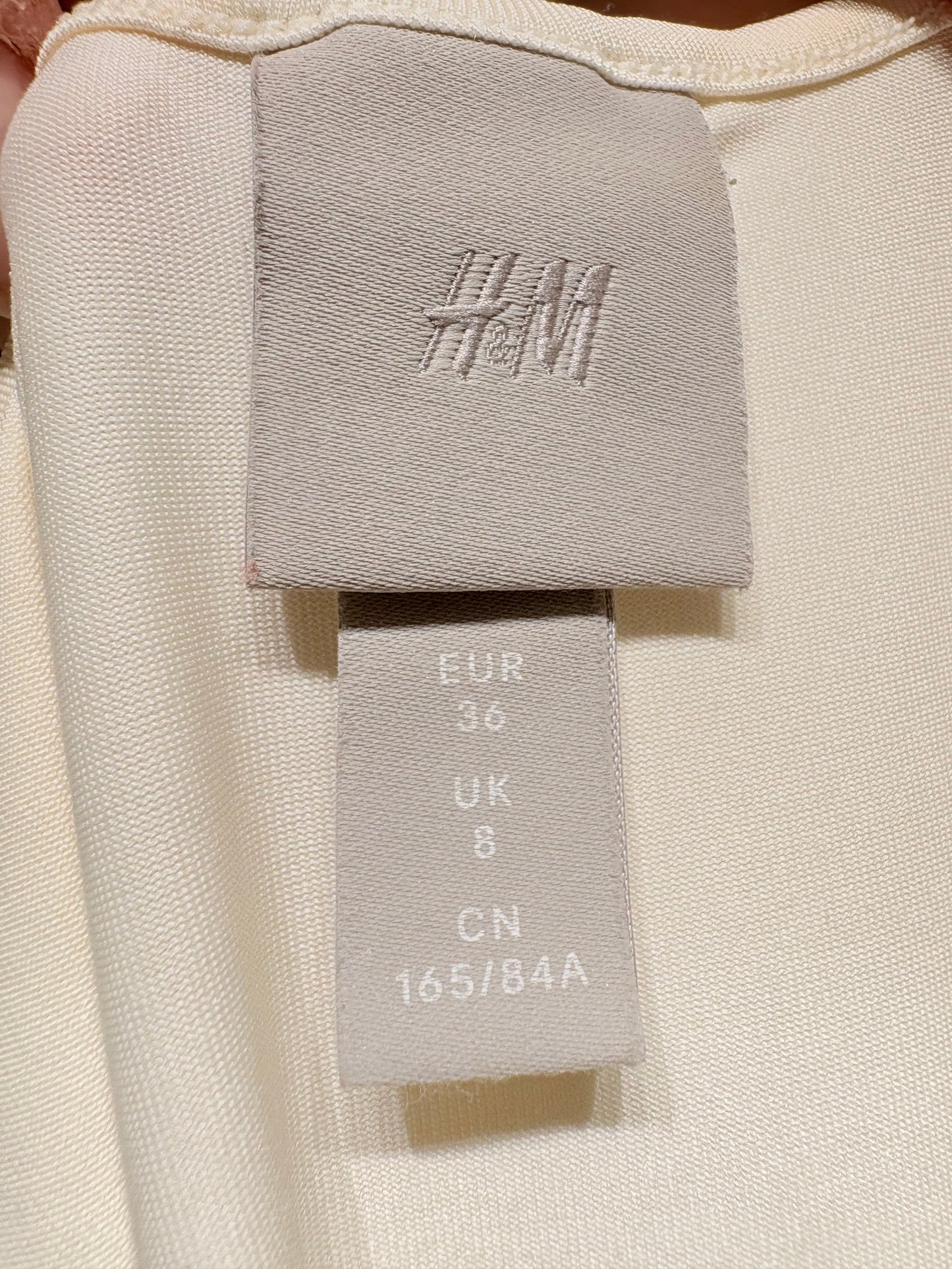 Vestido topitos jaspeados de H&M